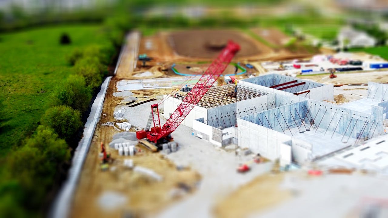 An active construction site, symbolizing the successful building and growing of a business by Strategic CFOs)