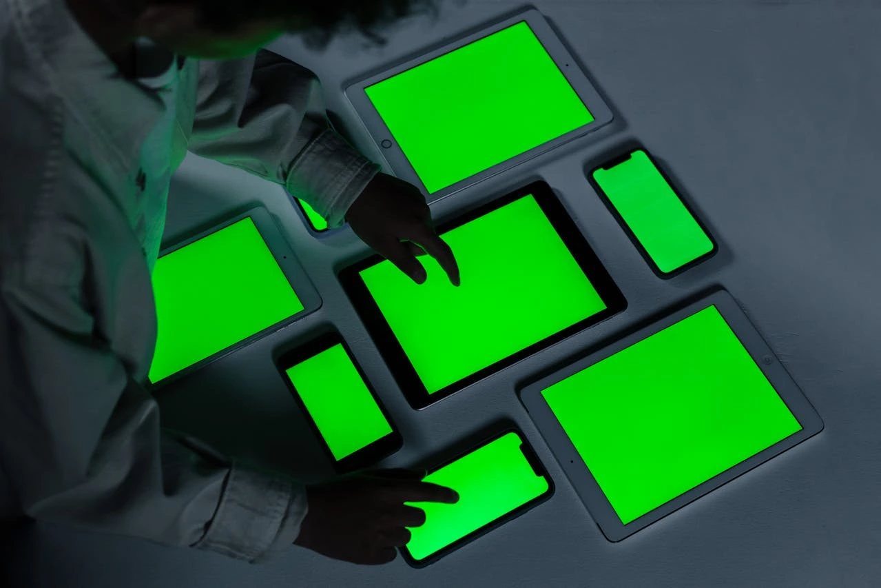 A team of finance professionals collaborating around a digital dashboard screen in a modern office setting, symbolizing the integration of technology and strategic financial insight.